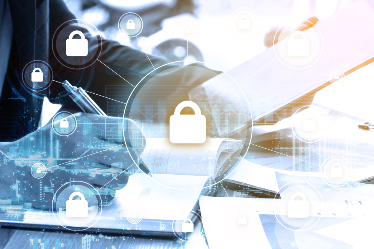 Working man with cybersecurity padlock icons floating around him