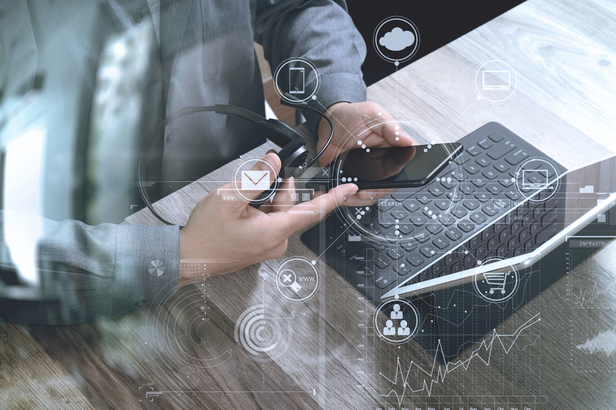 A man looking at a phone with a graphic over the top of it to represent VoIP integrations